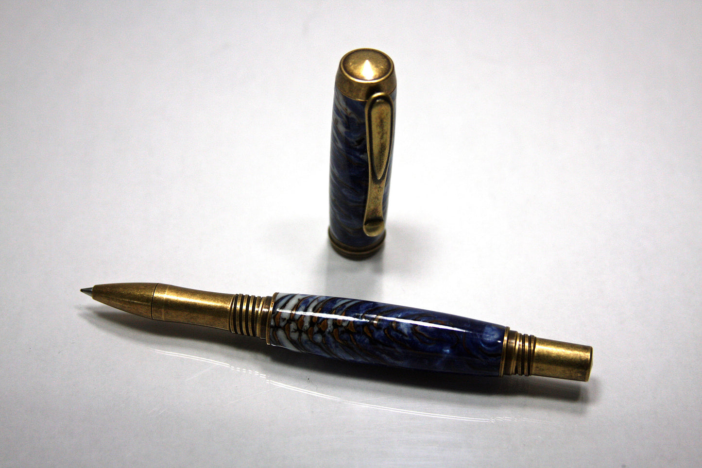Rollerball Pen with Antique Brass Finish | Pinecone-Embedded Blue Resin