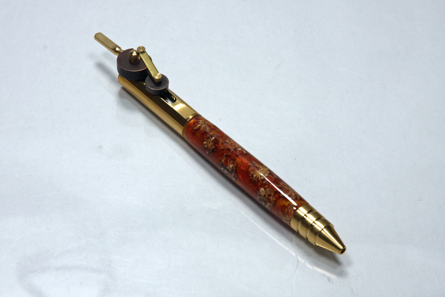 Steampunk Inspired Piston Ballpoint Pen with Dual Finish Gears and Pinecone Resin Body